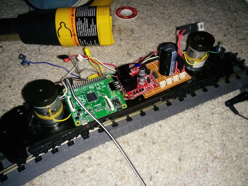 Initial fitting of all of the components. From left to right: Raspberry Pi model A+, LN298 motor controller, custom AC->DC conversion board with smoothing cap.